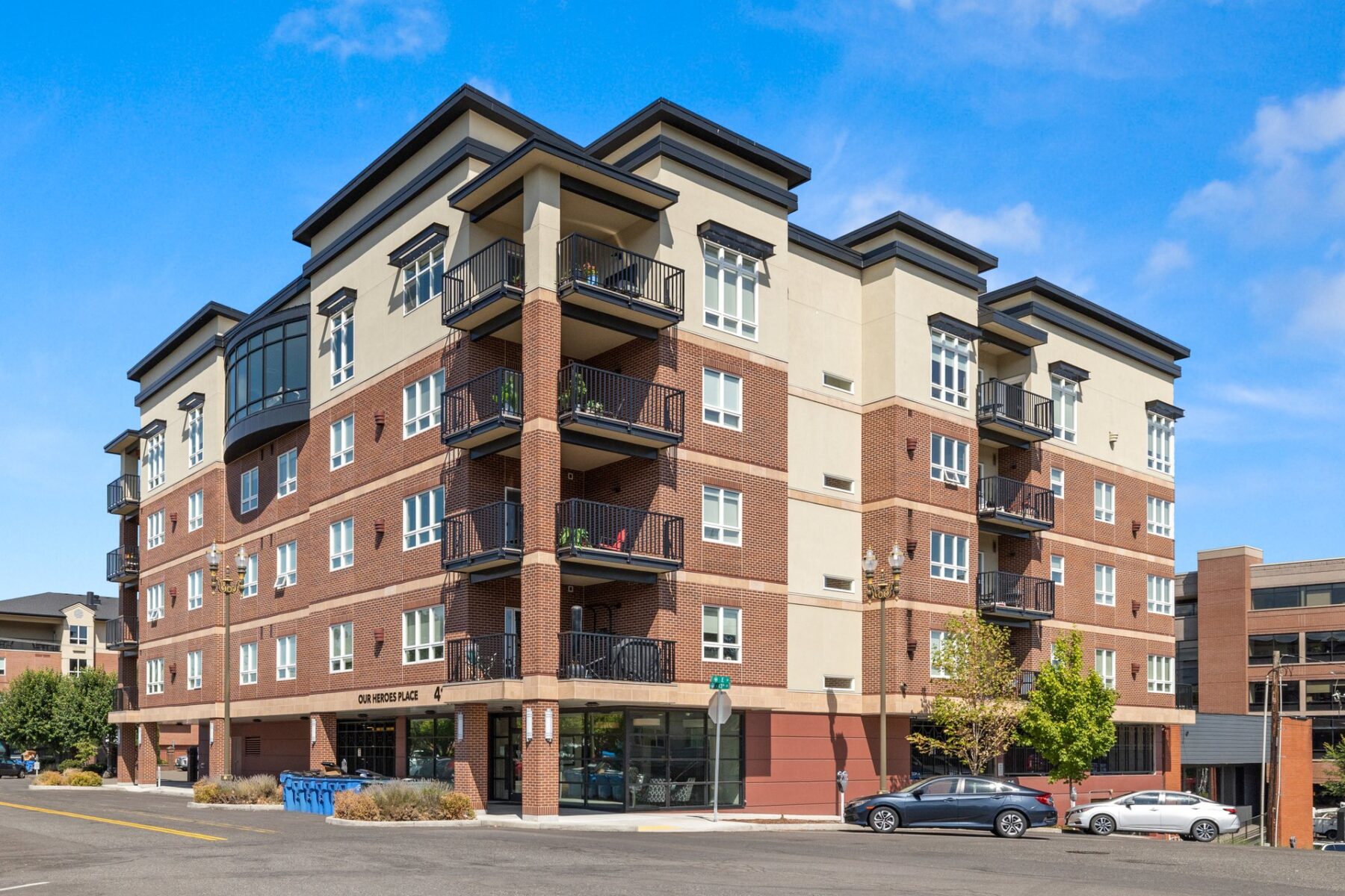 building exterior showing private balconies and street level parking